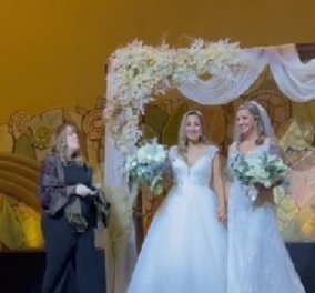 Δύο νυφικά, χωρίς γαμπρό: Δύο Ελληνοκαναδέζες στα βίντεο από τον «μεγάλο, ελληνικό, λεσβιακό γάμο» τους 